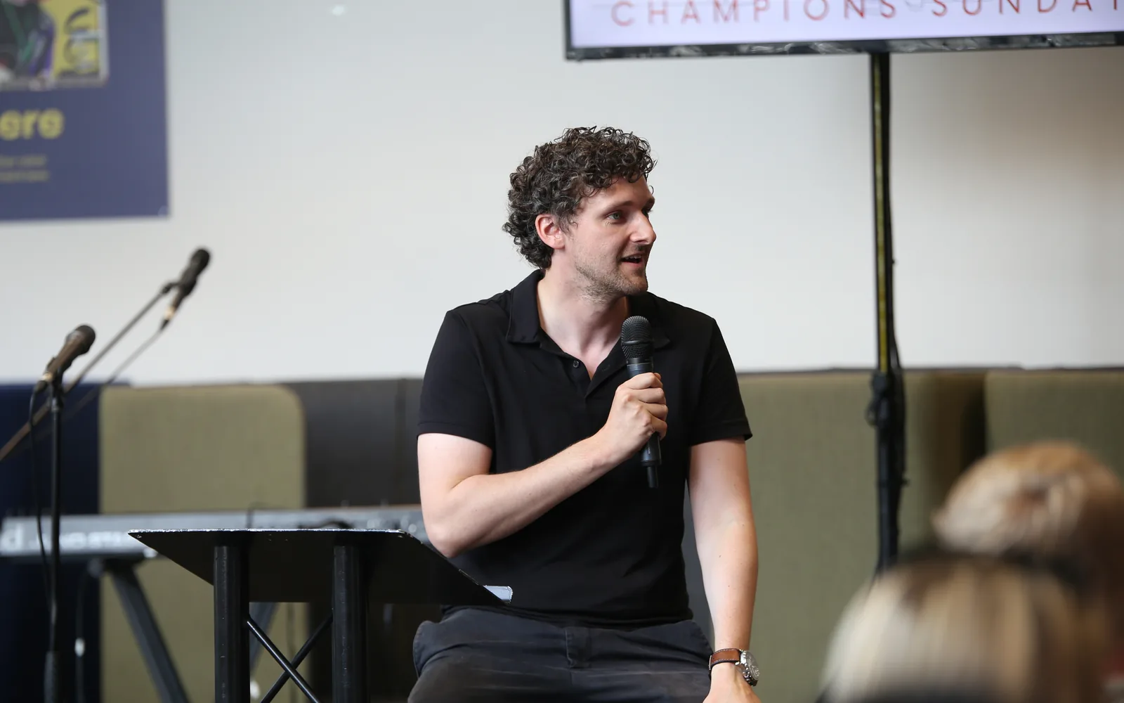 A speaker sharing a message during Champions Sunday at C3 Liverpool